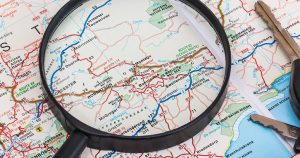Map and magnifying glass with car keys | Goldstein Chrysler Jeep Dodge RAM