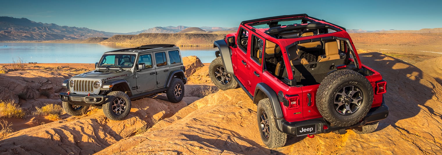 2022 Jeep Wrangler mountain climbing in red or silver
