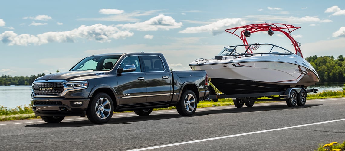 New 2022 RAM 1500 Truck towing a boat